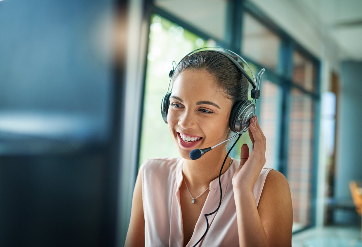 Happy receptionist answering a call